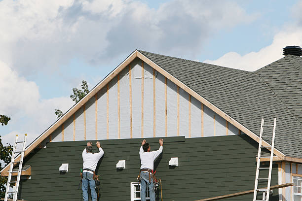 Professional Siding technician working in Brave, PA